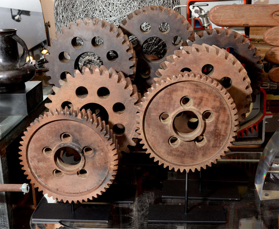 This collection of early 20th Century Micarta Industrial Gears provide a cool accent to any living space. Micarta is a predecessor to carbon fiber and in this form was created by linen, paper and high pressure forming. All on custom mounted stands.