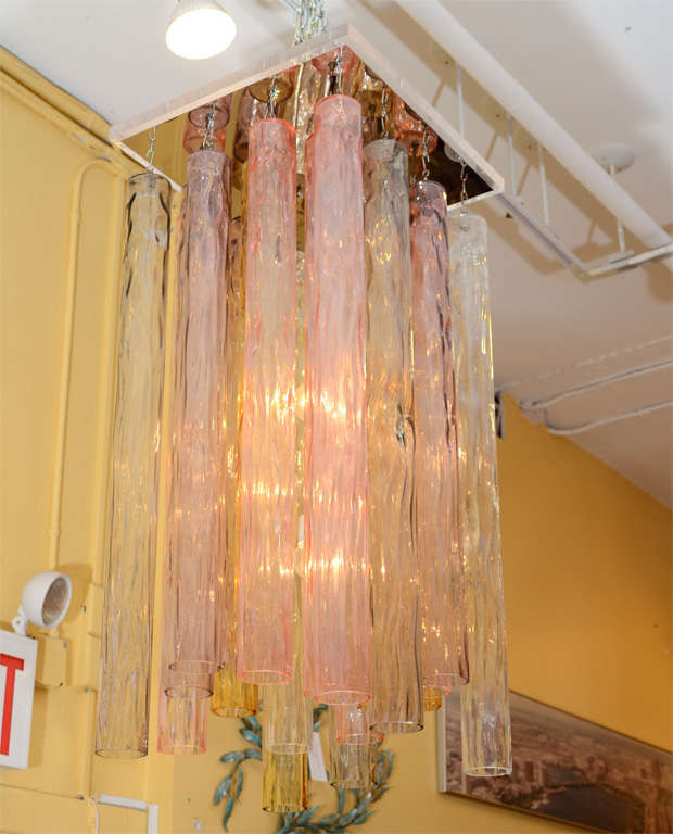 Wonderful assemblage of Barovier and Toso cylindrical crystals suspended from a custom lucite and mirrored armature. The crystals are in five different soft colors and are arranged to have a beautiful effect. Enchanting! Please contact for location.