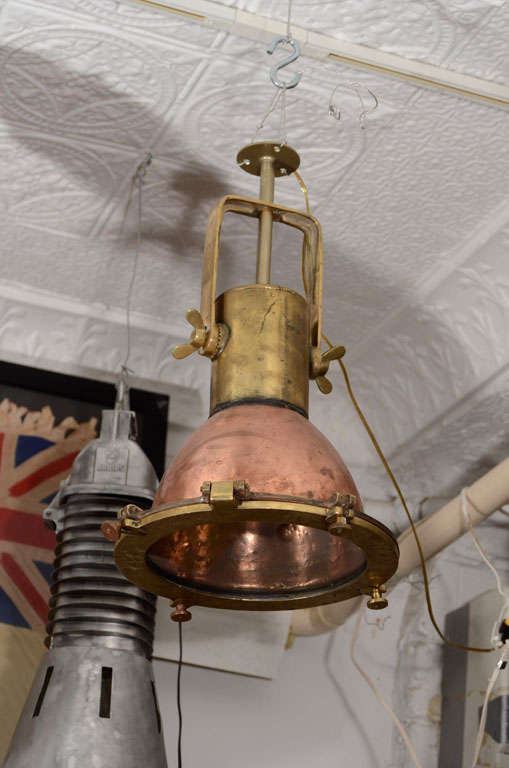 Pair of reconditioned Nautical Pendant Lights from a Dutch Naval Vessel.
They have been completely Rewired for Indoor and Outdoor Use.  Priced Individually.