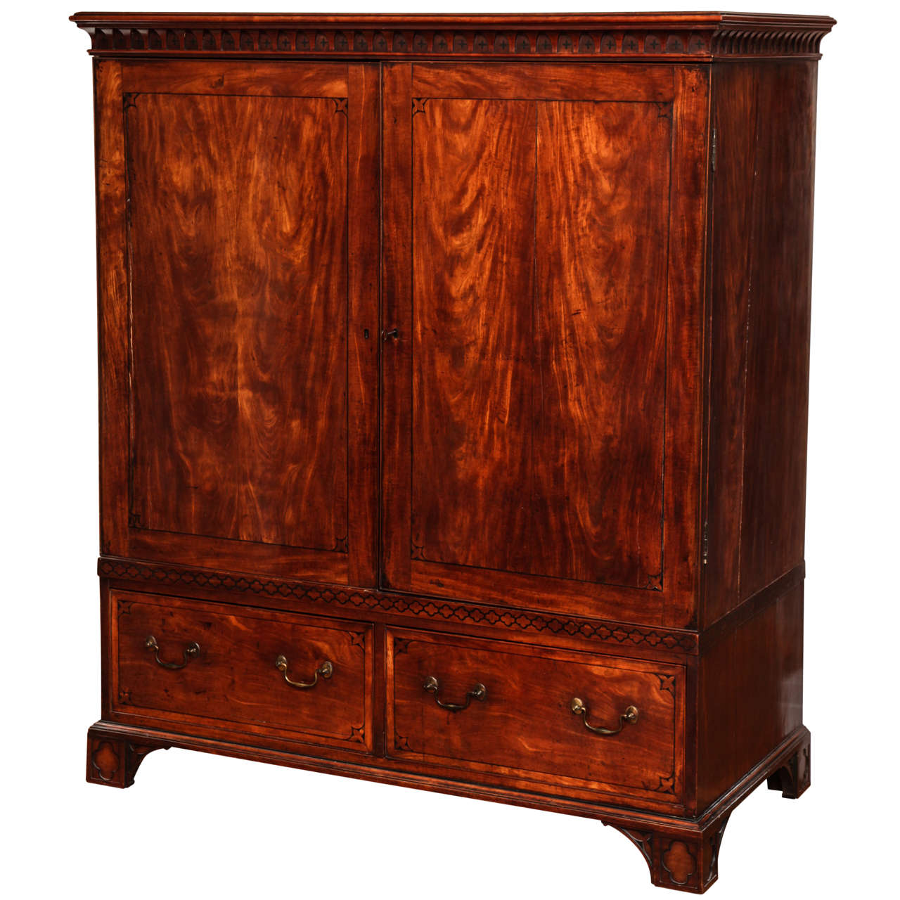 A Rare George III West Indian Satinwood Clothes Press of Gothic Design