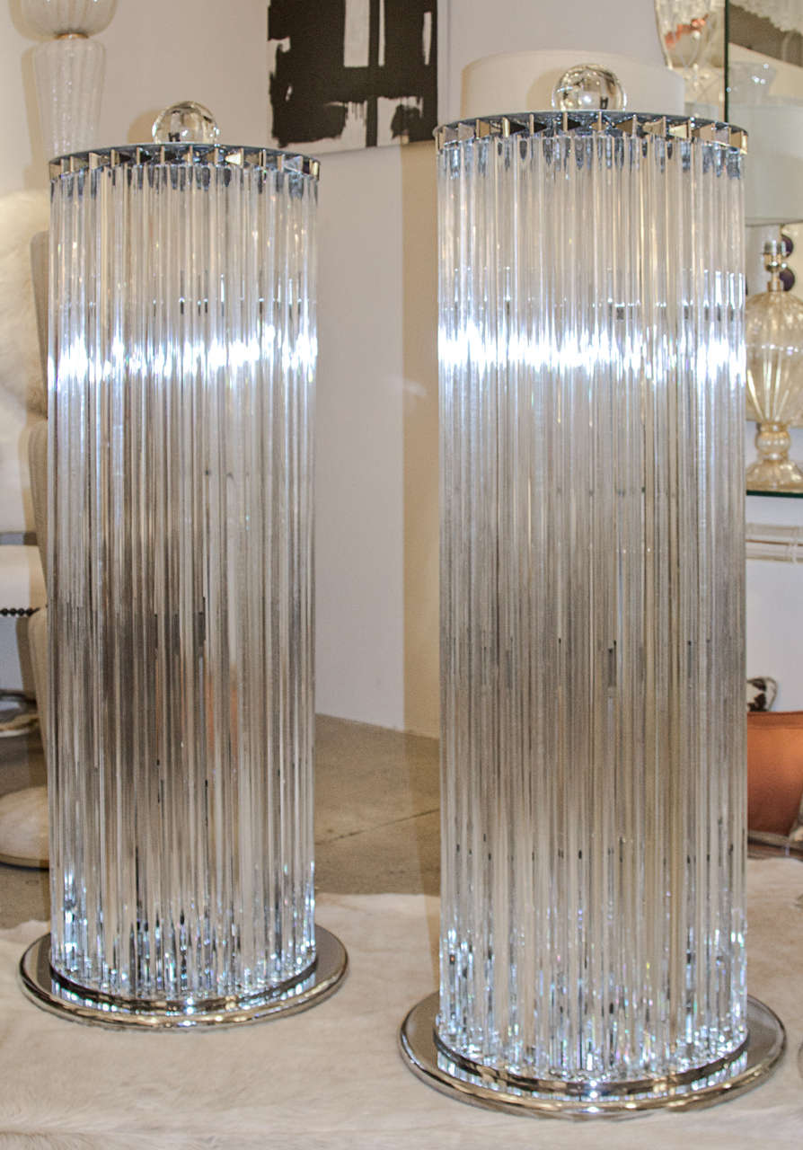 Pair of crystal prism Murano glass and chrome floor lamps. Each of these lamps consist of individually handblown clear triedri (three sided prisms) attached at both ends to chrome plates. Base is 20