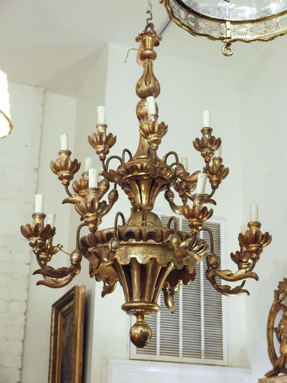 Italian Two Tiered Gilt Wood Chandelier with 16 lights. 
