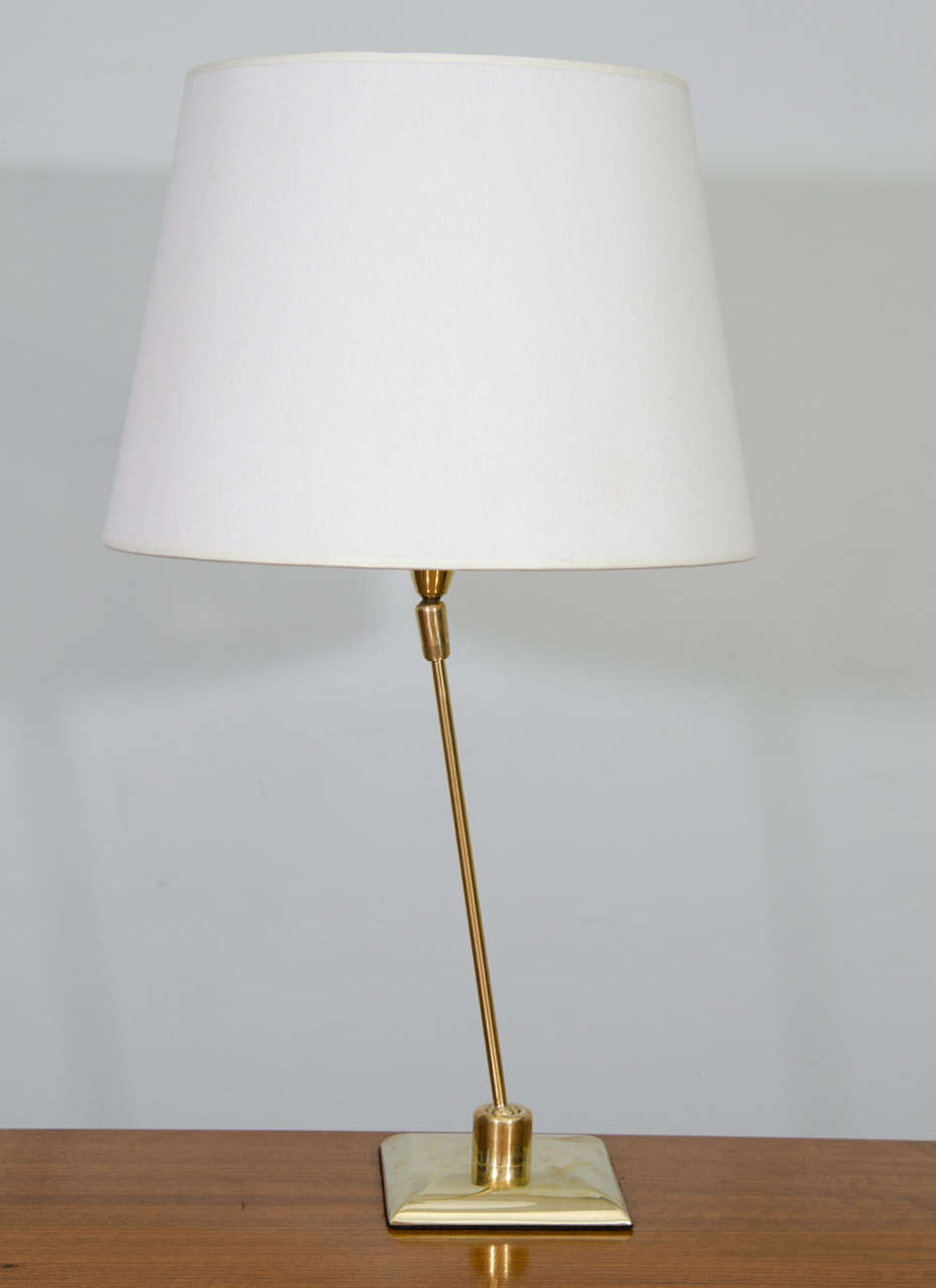 A French brass desk lamp that features articulation on the base and shade. The lampshade (height 8.5