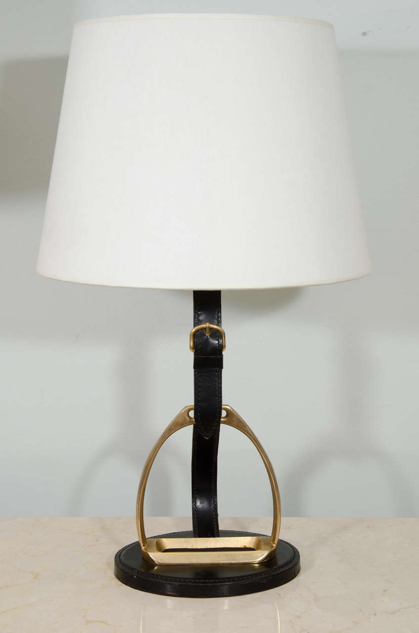 Quintessential desk lamp with black leather wrapped details and brass stirrup. Silk shade.