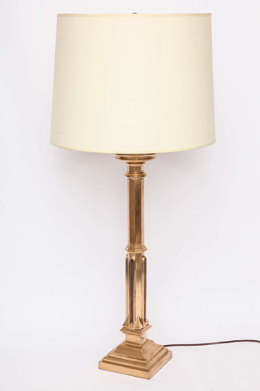 A 1920s Art Deco Gothic modern polished brass table lamp.
Shade not included