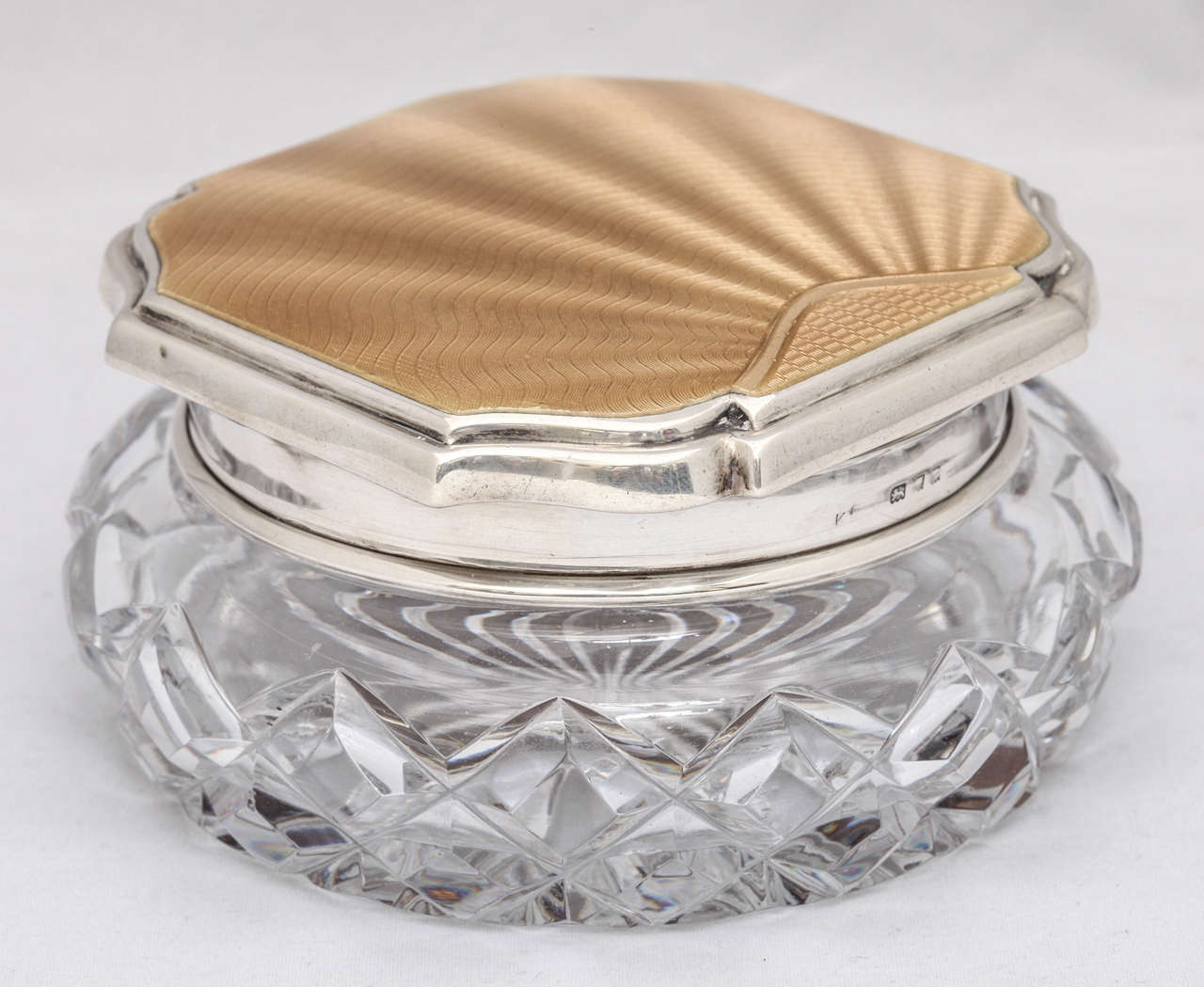 Beautiful Art Deco, sterling silver and champagne colored guilloche enamel - mounted crystal powder jar, London, 1934. @2 1/2