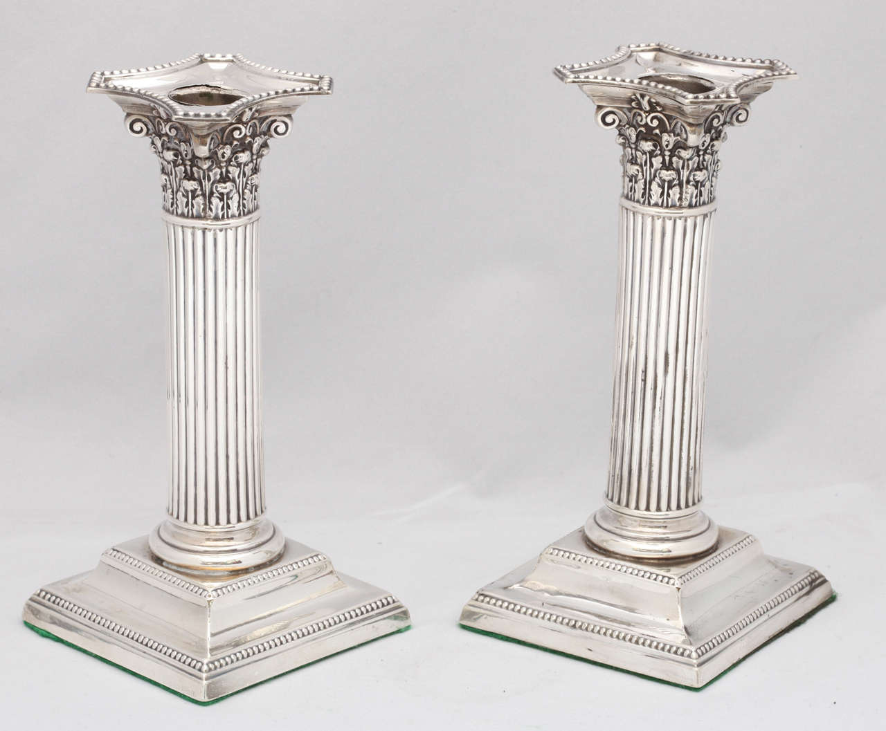 Pair of neoclassical, sterling silver, Victorian, Corinthian column-form candlesticks, Birmingham, England, 1897, H. Matthews - maker. Measures: 6 3/4