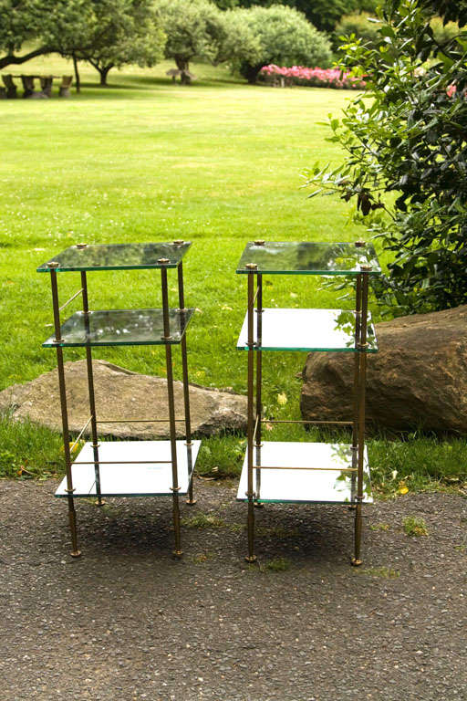 In the manner of Maison Jansen, a pair of end tables with 3 levels of patterned mirrored glass