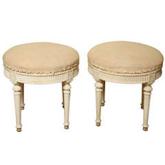 A Pair of Upholstered Round Swedish Ottomans