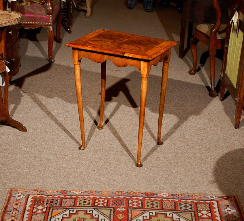A small walnut side table with oyster veneered top, shaped apron and pad feet. <br />
<br />
For many more fine antiques, please visit our online gallery at: www.williamwordantiques.com<br />
<br />
William Word Fine Antiques: Atlanta's source