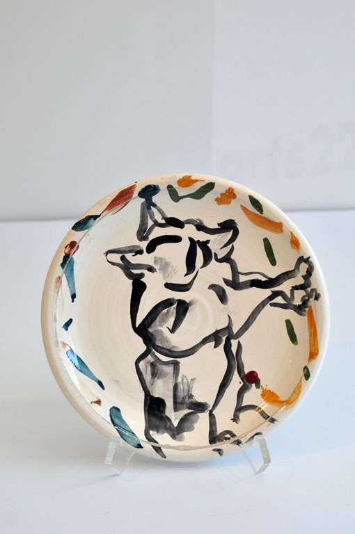 A very early ceramic plate by Los Angeles postmodernist artist Peter Shire (b. 1947). Incised signature and dated 1-15-75 on back. The lively, vibrant design is of an animal figure. Well-known for his constructivist-inspired teapots of the 1980s,