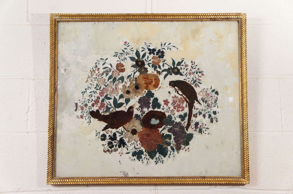 Here is a beautiful and large scaled eglomise of birds and flowers in white.