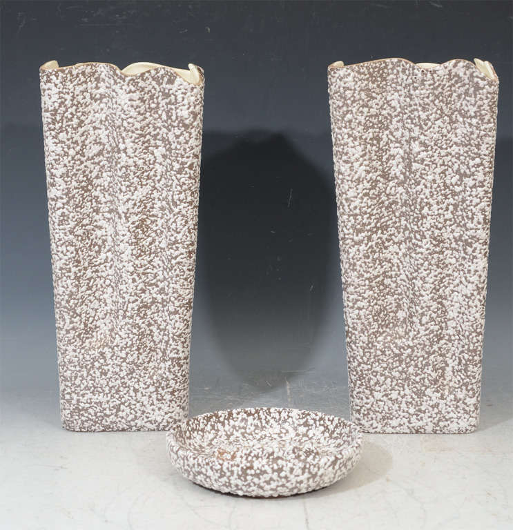 A three piece set by Royal Haeger consisting of two tall vases and an ashtray or dish. Each piece has a pebble or popcorn textured glaze.

Reduced from $675.00