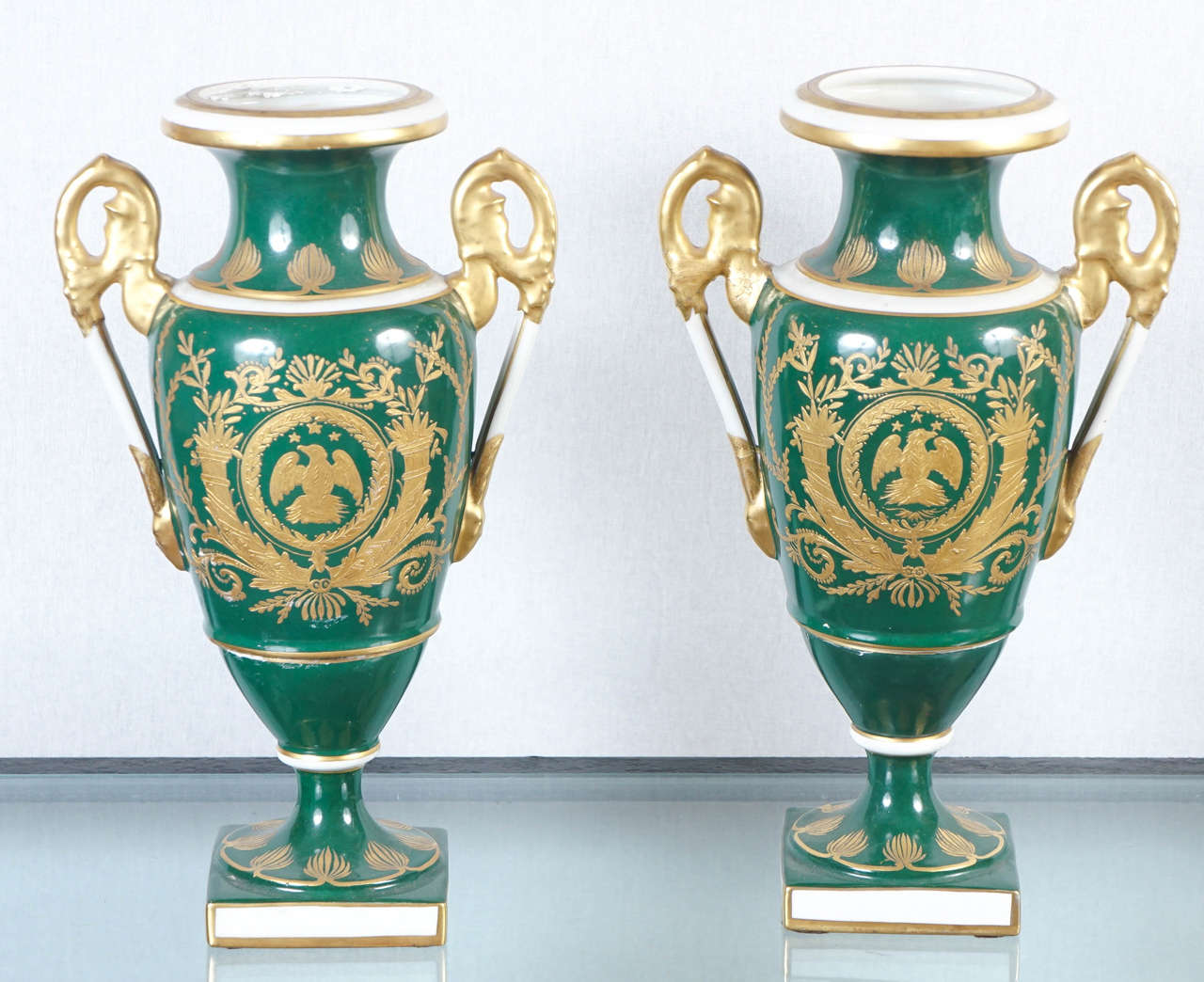 A pair of Porcelain hand-painted Lamp bases in the style of Empire Period in France.