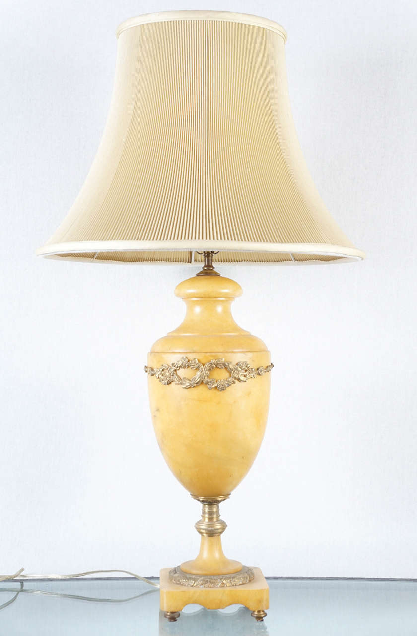 A French alabaster lamp with  bronze accents Louis VI style.