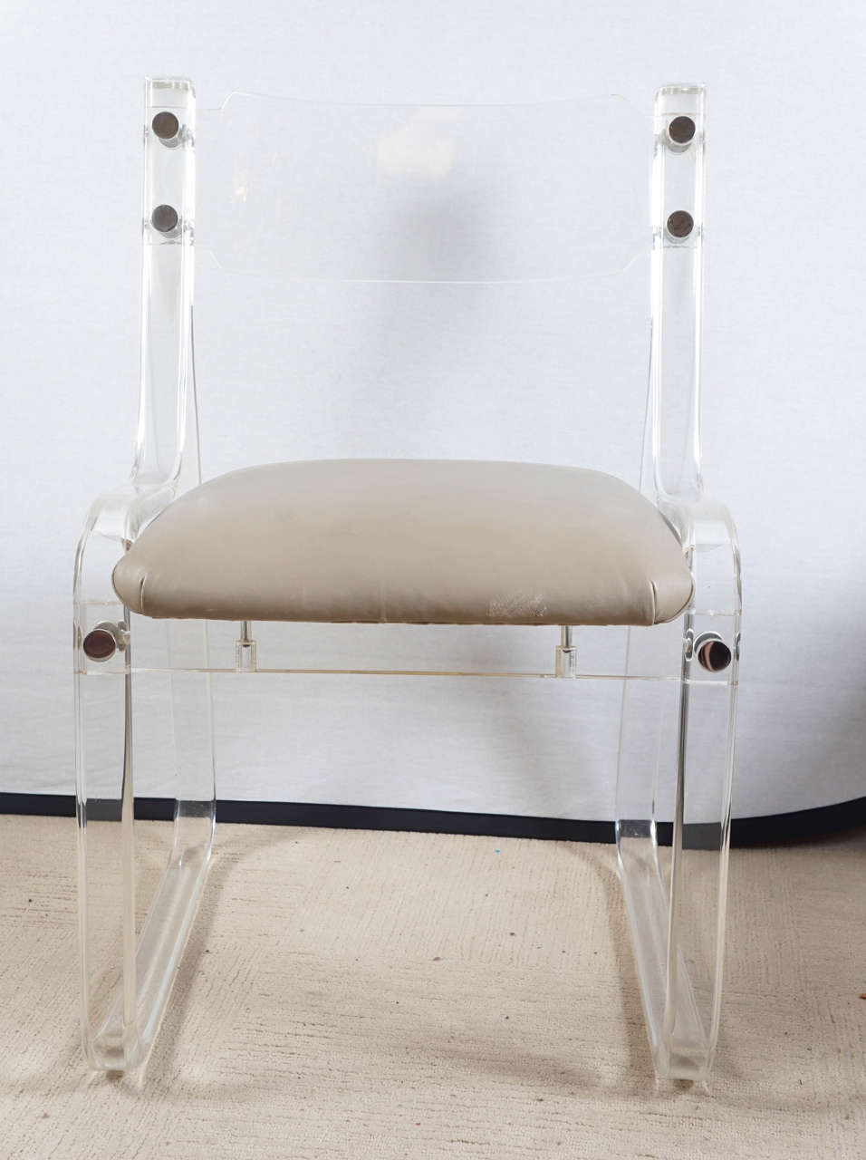 A mid-century Lucite Chair with a label on the bottom from Ambar Furnature Inc. NYC