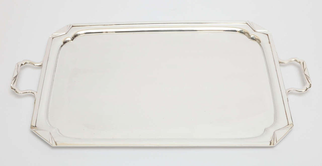 A stunning Art Deco Sheffield plate silver plated serving tray. This is a fabulous example of elegant and bold Art Deco design. The over cur corner rectangle shape is accented by stepped corner detailing along with similar detailing to the edge of