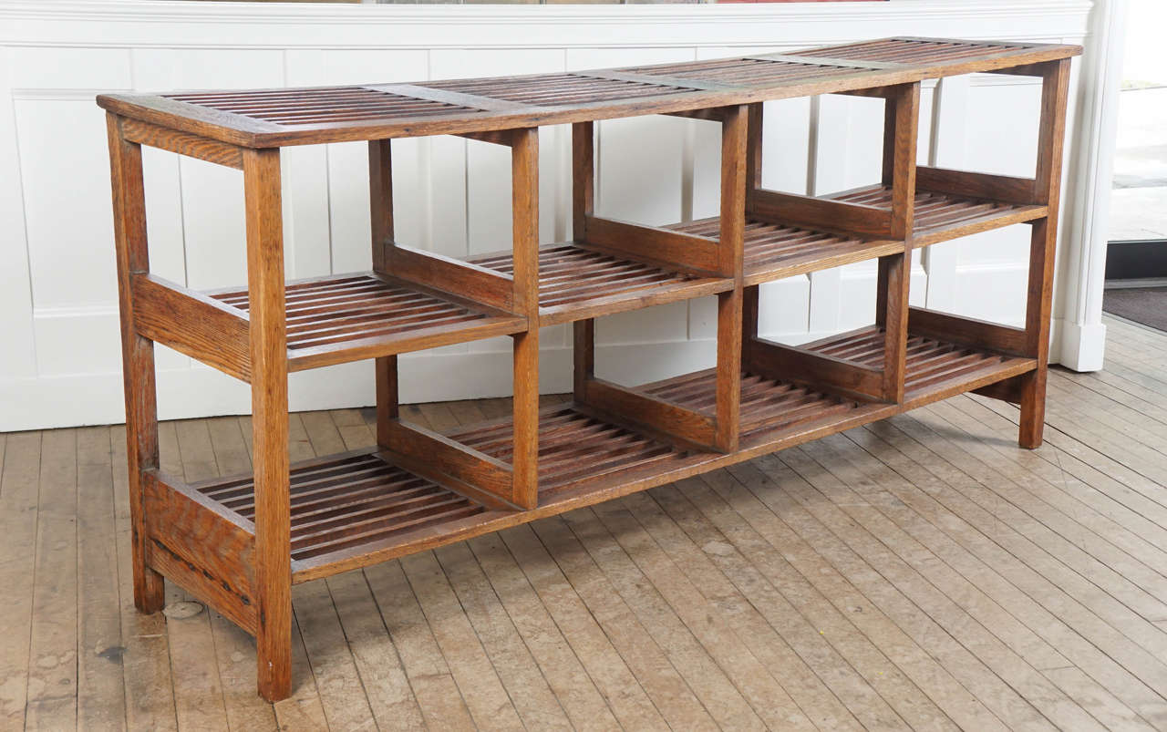 eight slatted compartmental units on legs - deep warm patina