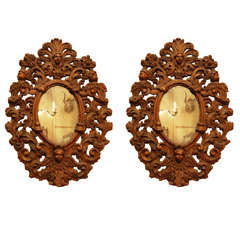 A Pair of Italian Baroque Carved and Gilded Wood Mirrors