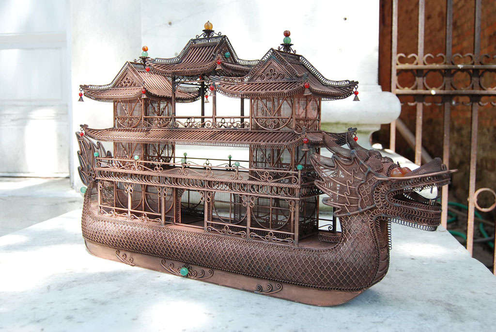 This large and decorative copper wire work junk or Chinese boat, thought made only 40 or 50 years ago, shows much attention to detail and refined work. Made as a decorative object most likely a table decoration the boat is enhanced with a dragon
