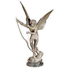 A Large Spelter Figure Of A Winged Churb Signed