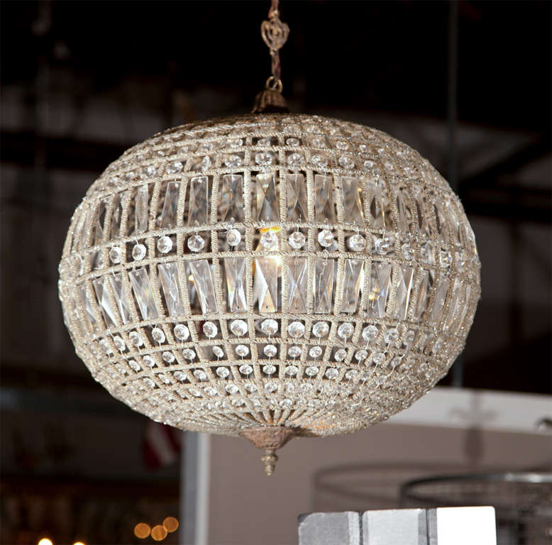 Exquisite globe pendant chandeliers, each in oval shape wired with crystals. Please note the pictures didn't show but they come with short chains and canopies. Can sell separately. Price is for each!