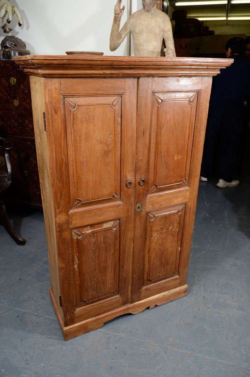 Traditional colonial style teak armoire with single shelf