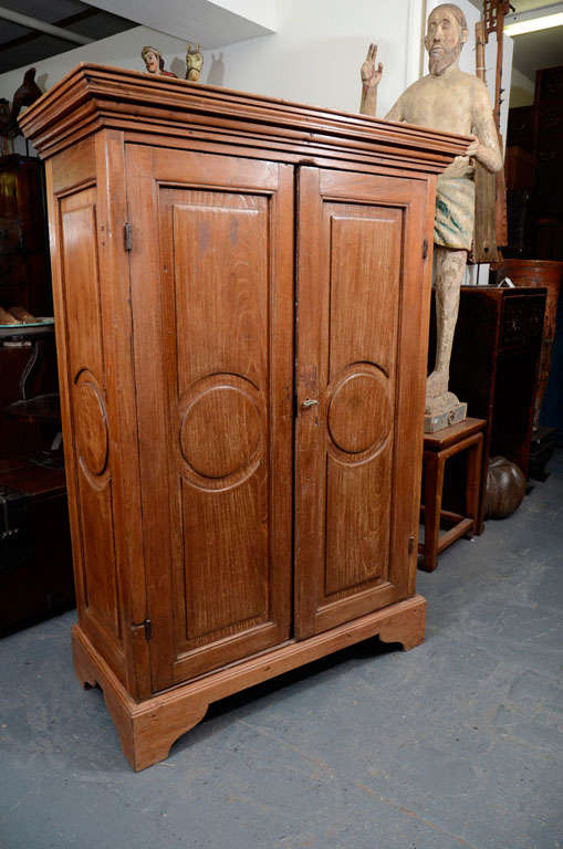 Double door Guatemalan oak armoire with 2 shelves, and a secret top cabinet that sits flush to the top.