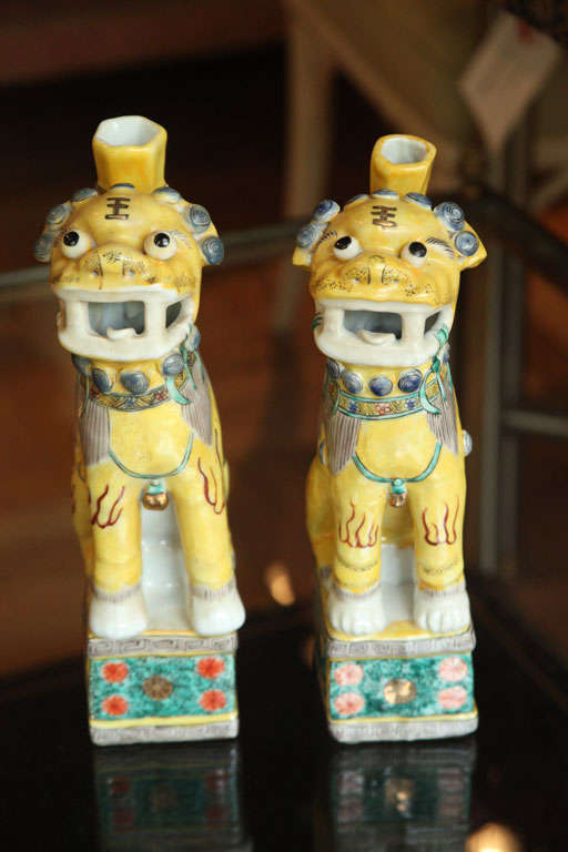 A Pair of Chinese Polychrome Decorated Seated Foo Dogs, 20th c. 1