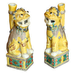 A Pair of Chinese Polychrome Decorated Seated Foo Dogs, 20th c.