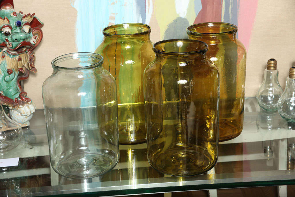 A Set of Four Citrine and Clear Glass Storage Jars, France c. 1920