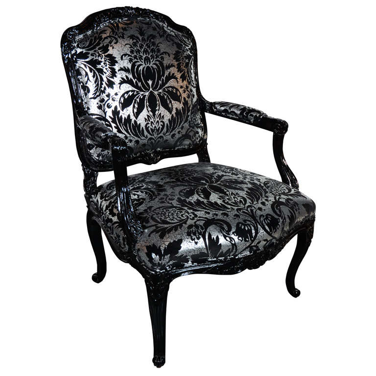 Hollywood Regency Louis XVI style armchair in high gloss black lacquer. Upholstered in vintage embossed chaucer velvet with damask print by Andrew Martin, in hues of platinum and black. 