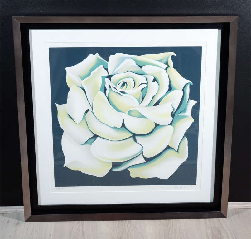 Vintage colored lithograph art by Lowell Nesbitt. Rose lithograph has hues of white, green, yellow and blue over a black background. Limited edition item 124/200, and is signed by the artist. Mounted and features custom shadowbox frame in black wood