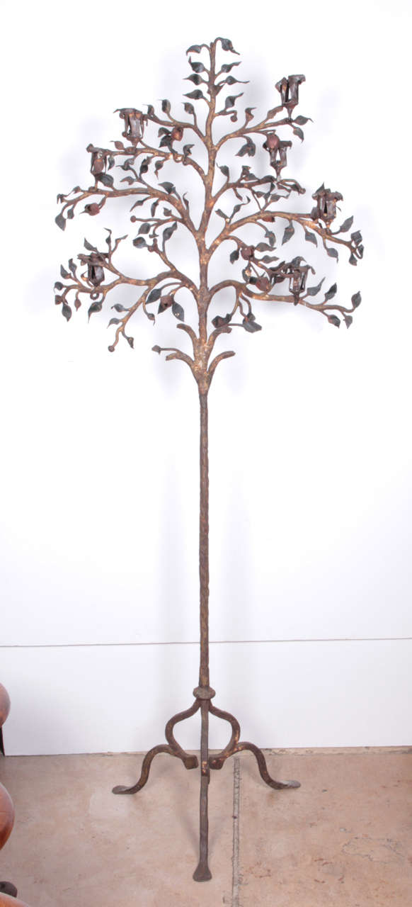 Unique and rare forged iron 7-candle holder in the form of a tree.  Unbelievable craftsmanship of leaves and flowers.  An artistic and utilitarian addition to any home.  American circa 1880.