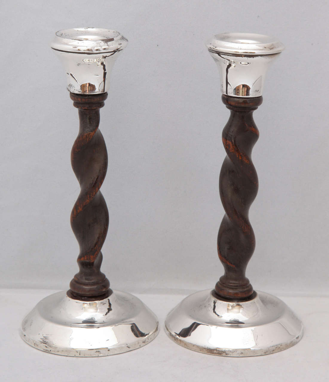 Art Deco, Jacobean-style, sterling silver and barley twist wood candlesticks by Joseph & Richard Griffin, Chester, England, 1925. Measures: 7 3/4