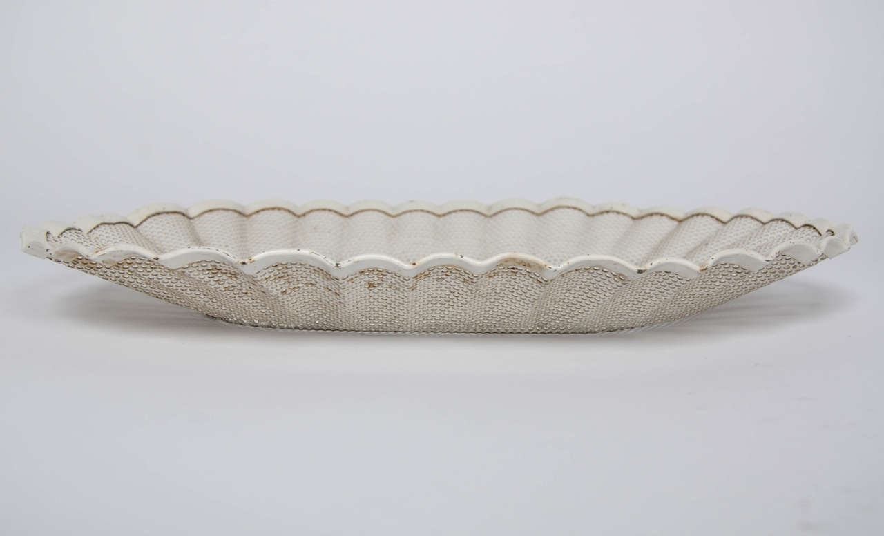A rare Mathieu Matégot low bread basket made of perforated and pleated 