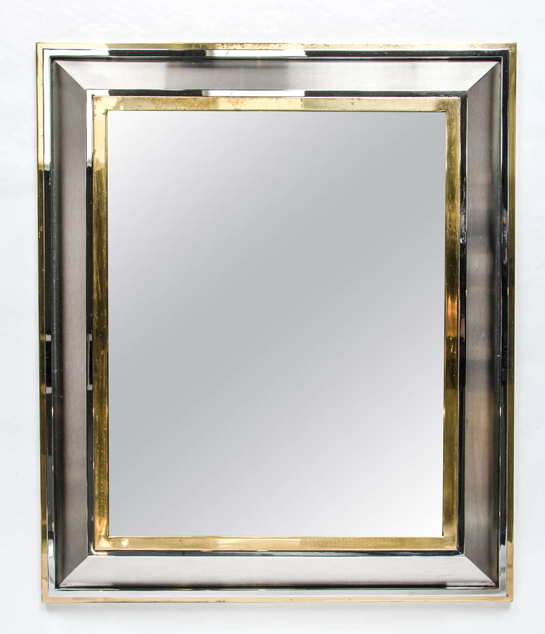 Brass, Chrome and brushed steel mirror by Maison Jansen. Excellent condition, France, circa 1950