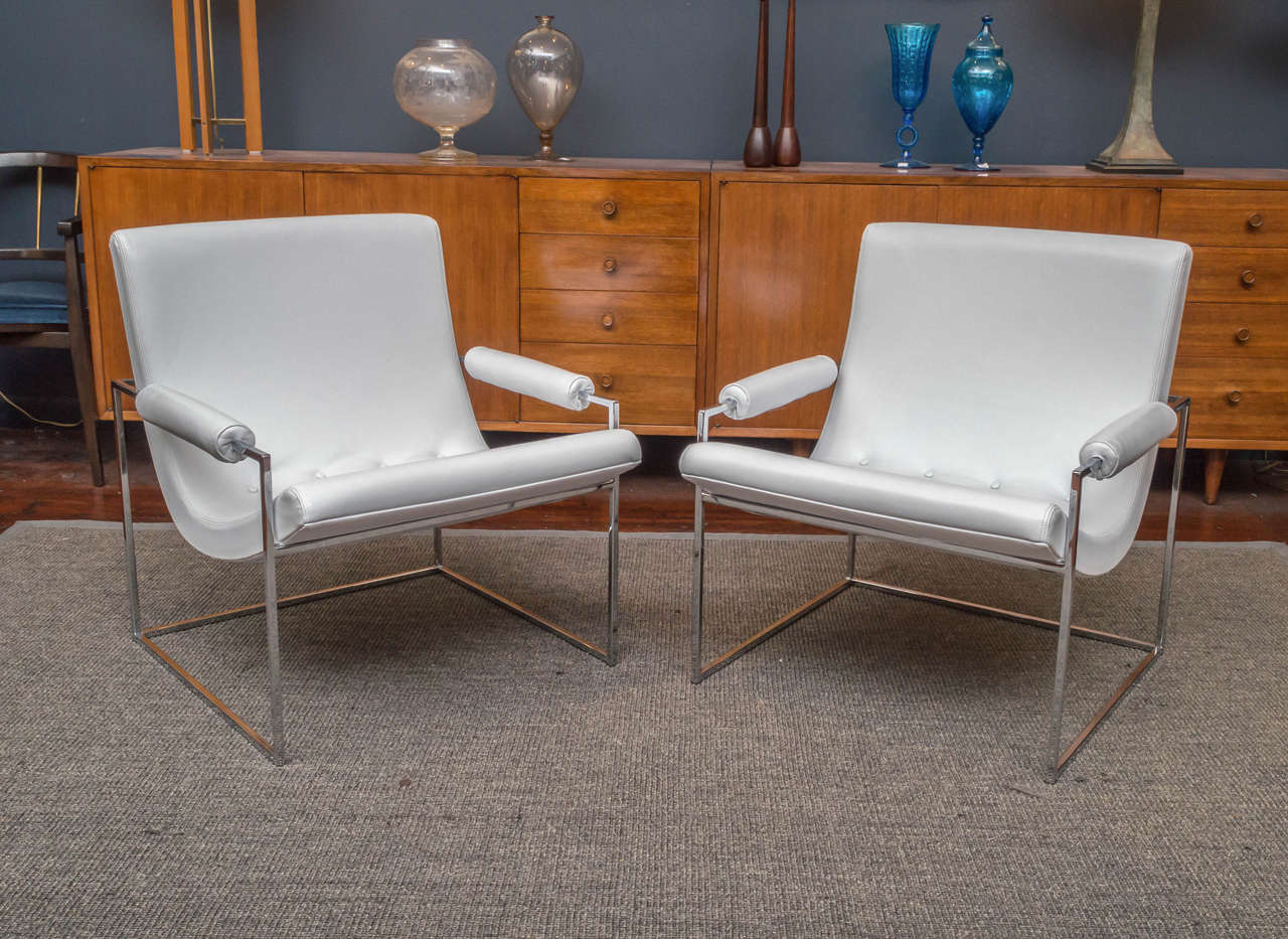Milo Baughman design lounge chairs for Thayer Coggin. 
Simple clean boxed chrome frames supporting a scoop form lounge height seat, newly upholstered in Italian leather with stitched seams.
 Excellent condition!