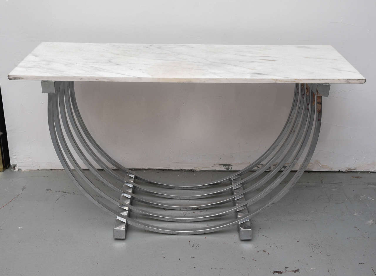 Wonderful chrome and marble console table by Donald Deskey, 1950s USA.  Also looks great with a glass top.
