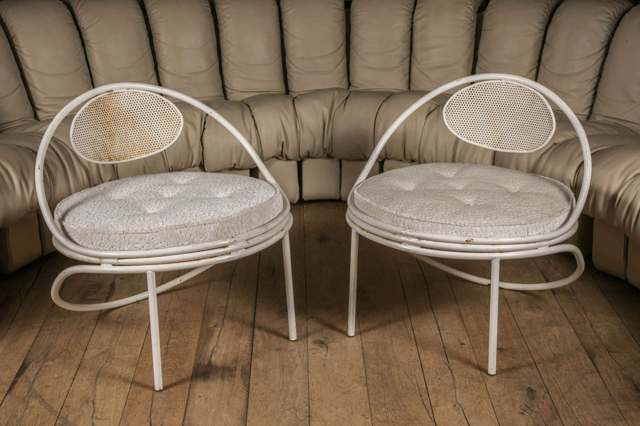 Pair of Copacabana Lounge Chairs created by Mathieu Matégot in 1955, round white enameled seating and perforated back rest.
Beautiful garden armchair, with graphical design, very rare in white color. 

The cushion and upholstery is newly done