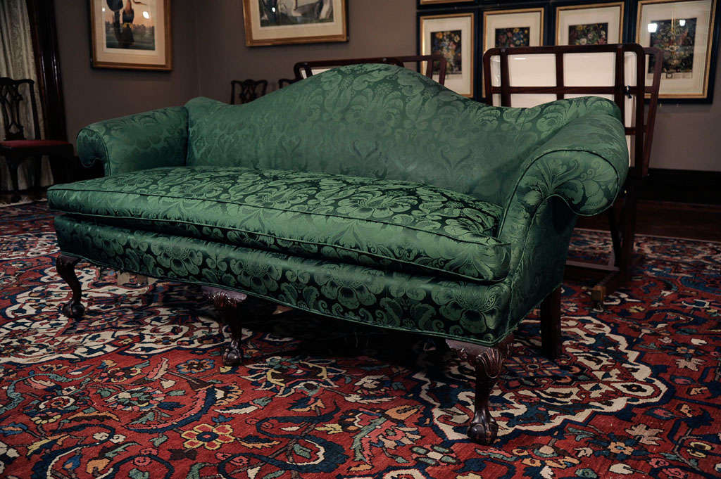 A Carved Mahogany and Upholstered Camelback Sofa For Sale 3