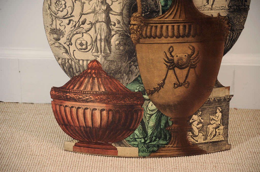 The shaped open stand printed and colored with five images of Etruscan vessels.