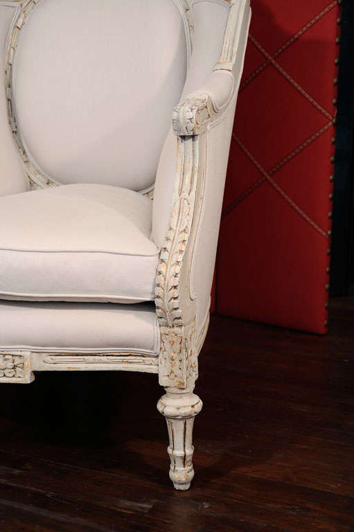 Great pair of grand bergere chairs with an off white/gray painted over gold. Just enough gold shows through to give these a beautiful stunning look. Nice and comfortable.The chair totally surrounds you, you'll feel like a queen. Beautiful light gray