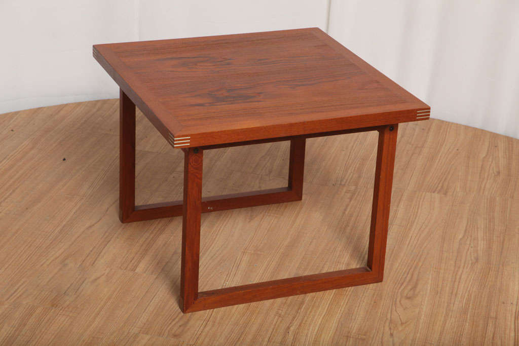 Small side table made of solid walnut, with very elegant inlaid brass on the corners.