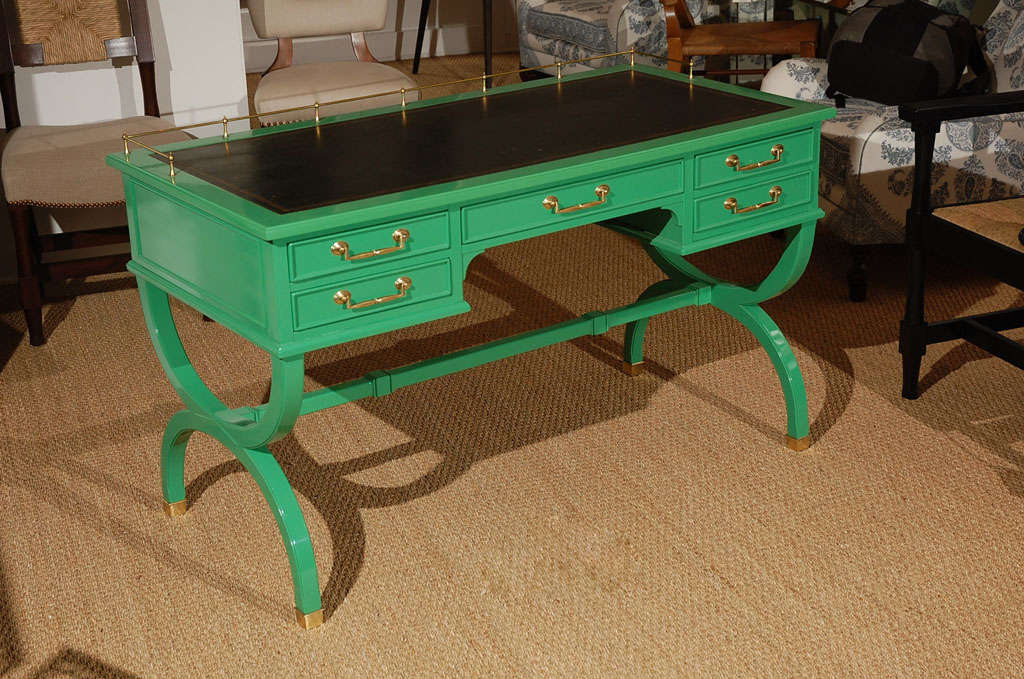 Chic desk with the original leather top and brass detail. Now lacquered green. From Beverly Hills estate.