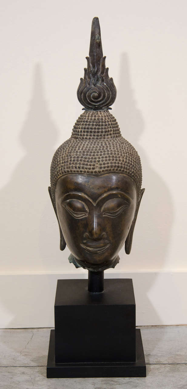 A custom mounted, regal bronze Buddha head from Laos. Circa 1930.
BH468