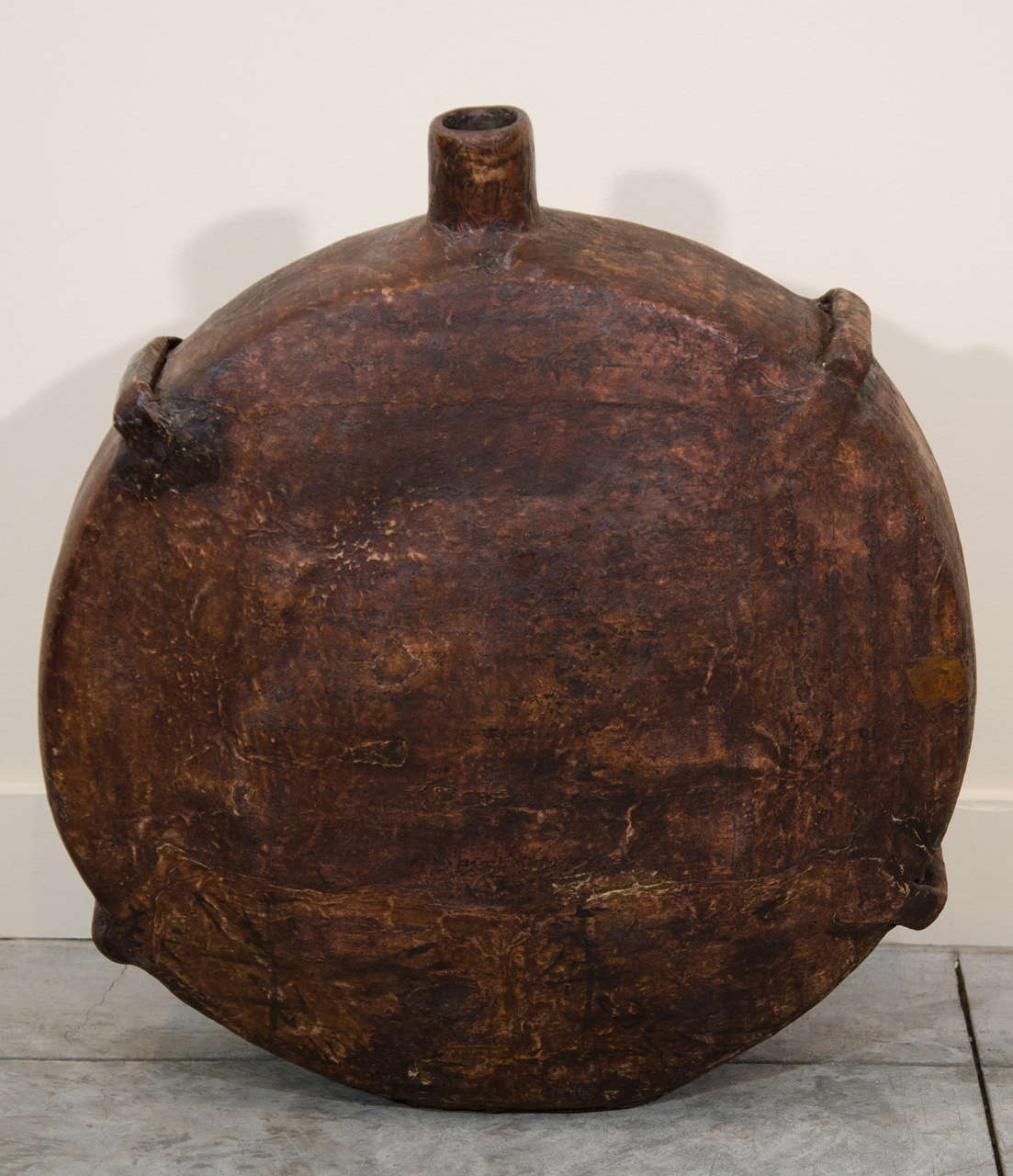A striking antique Chinese oil container nearly 20 inches in circumference with a wonderful patina. From Shanxi Province, circa 1900.
M777.
