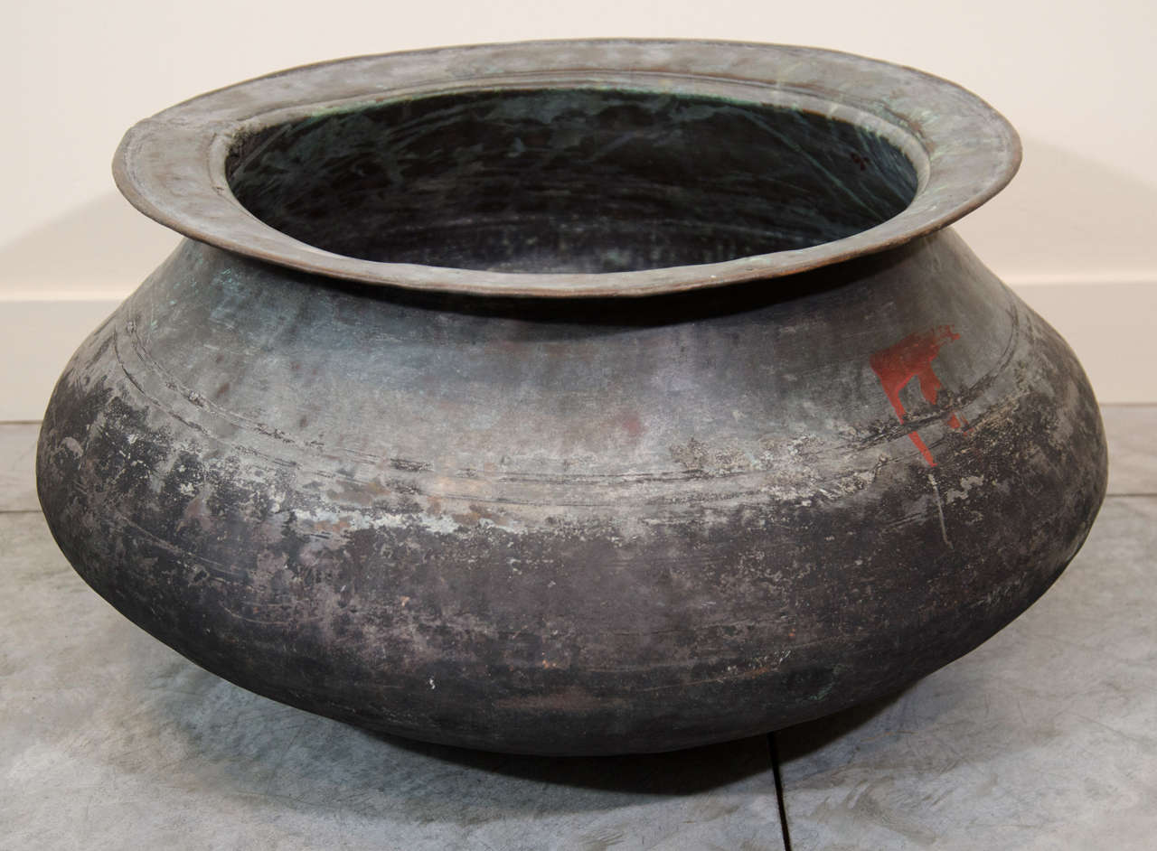 A large copper cooking pot from a temple in Burma. Wonderful patina. Burma, circa 1920.
M379