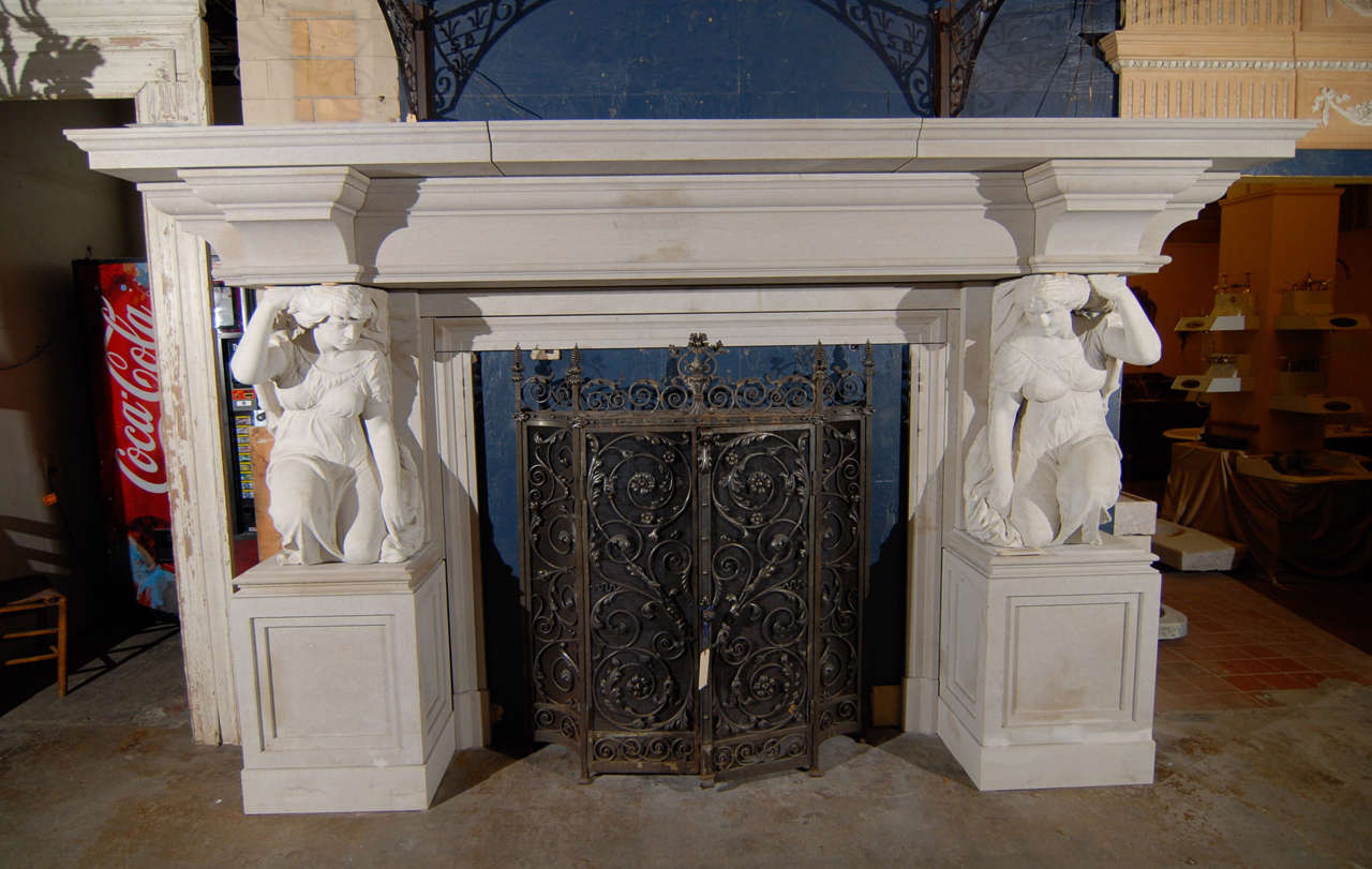 A massive recent carved limestone English mantel with original 19th.C caratyds holding up  brackets supporting the upper shelf. 

The firebox opening being : 64.5