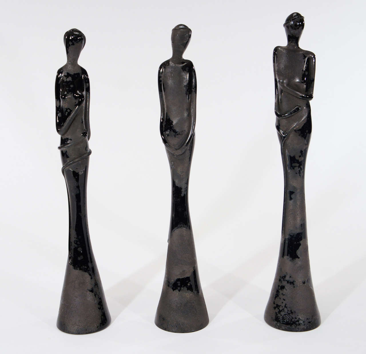 These three black glass female nude sculptures were made by Barovier and de-accessioned from the Jones Museum, still retaining the original labels. The glass technique, called 